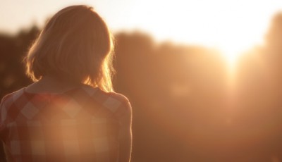 Lady Staring Into Sunset